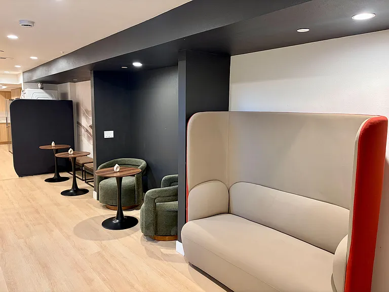 Shared lounge with booth seating, cafe tables, and comfy armchairsideal for studying, dining, or relaxing.