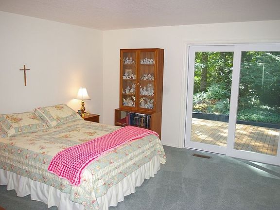 Ample master suite with door to deck