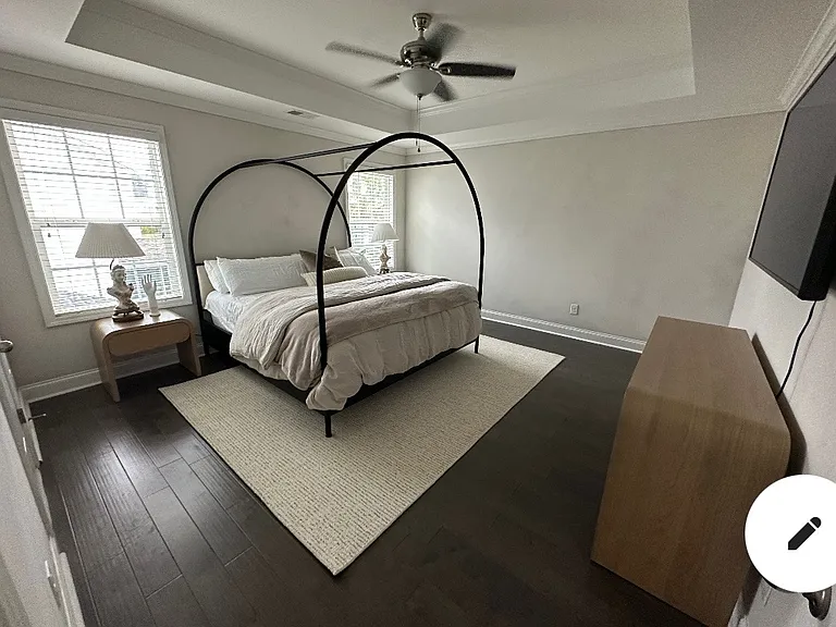 Primary bedroom upstairs with vaulted ceiling and large ensuite bathroom & closet