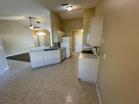 Eat in kitchen open to Family room sliding doors to screened in liana