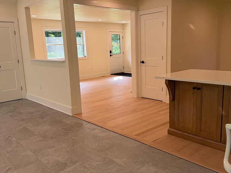 View of kitchen and living room from dining area