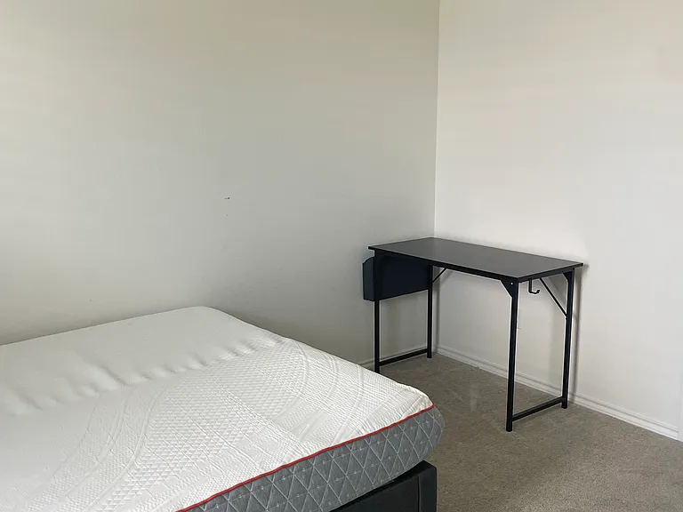 Room with bed and computer table