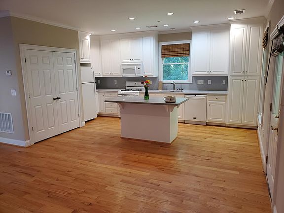 Open concept kitchen living room with plenty of cabinet space