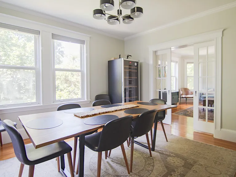 Dining/living room with pocket doors.