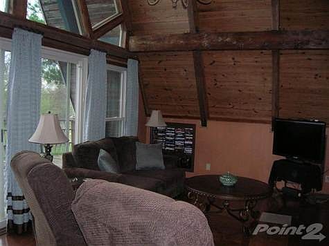 Main living room.  Owner says close to a full price offer, the seller will sell it as is how you see it