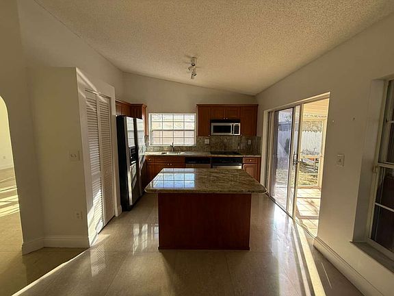 Updated kitchen with modern finishes and ample space