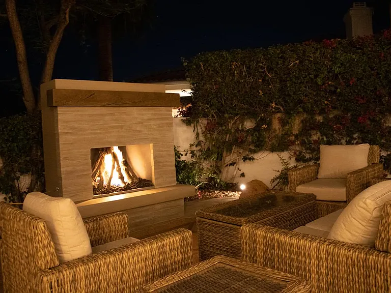 Outdoor fireplace at night.