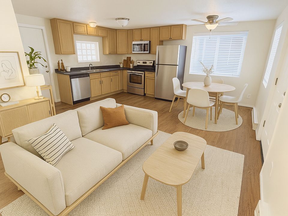 This photo of the living/dining room has been virtually staged.