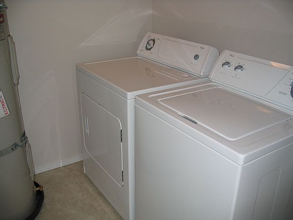Laundry room includes water heater