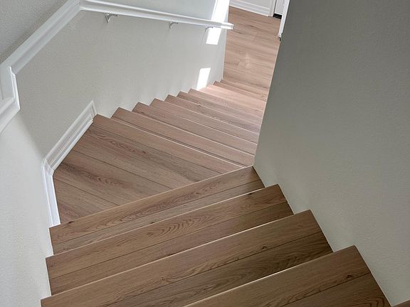 Enter the front door or garage to stairs up to the one level.