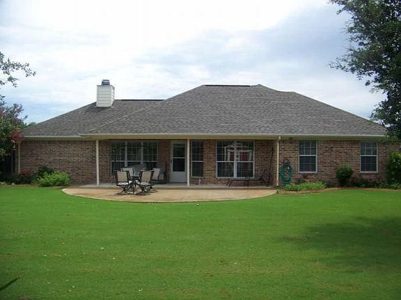 Back of House
						:
						A screen porch has seen been added to the back. Sit in comfort free from bugs!