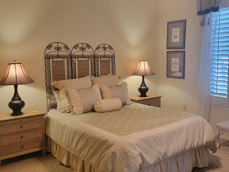 Guest bedroom with queen bed - triple closet, nice soft lighting for guests.