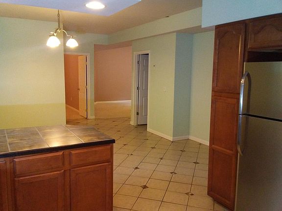 View from the kitchen looking at the two rooms and living room
