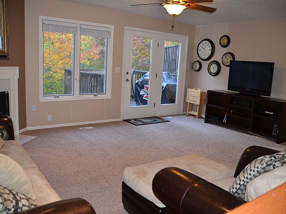 View of living room and deck from the kitchen.