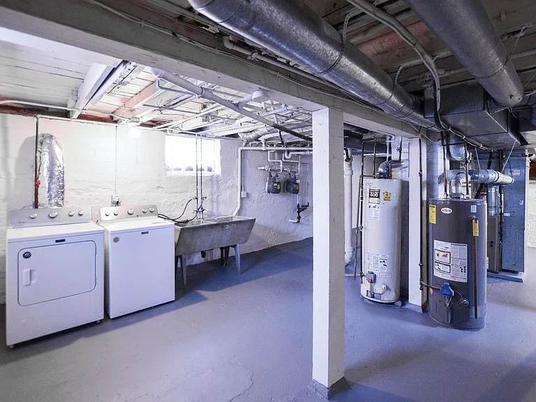 Dedicated washer & dryer in basement. 

Note: Water heaters in picture have since been replaced with brand new water heaters.