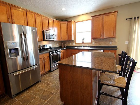 Maple cabinetry, granite island, upgraded Whirlpool Gold Appliances