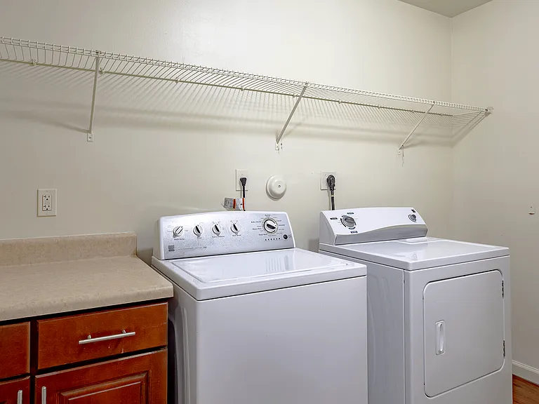 Full-size washer and dryer with bonus storage space.