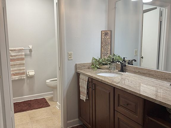 Master bathroom with walk-in closet and walk-in shower