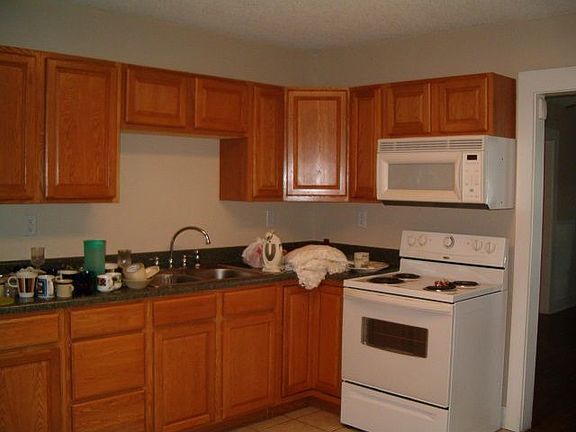 Completely remodeled kitchen, ceramic tile floor, oak cabinets