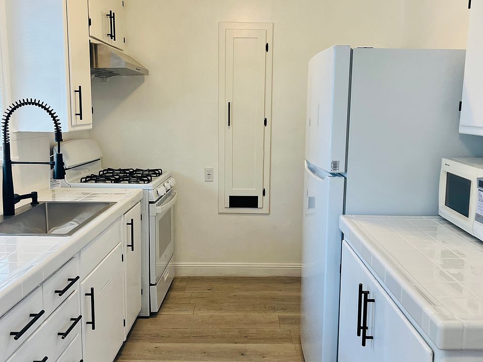 Kitchen with new refrigerator and stove