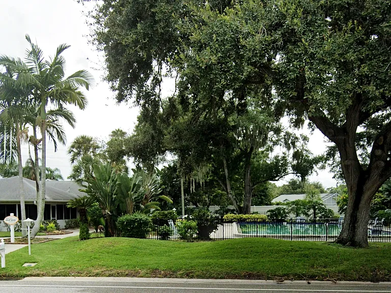 View of community clubhouse and large pool, located a few steps from our building.