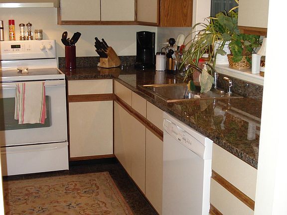 Kitchen granite counter tops, dishwasher, disposal, stove, refrigerator