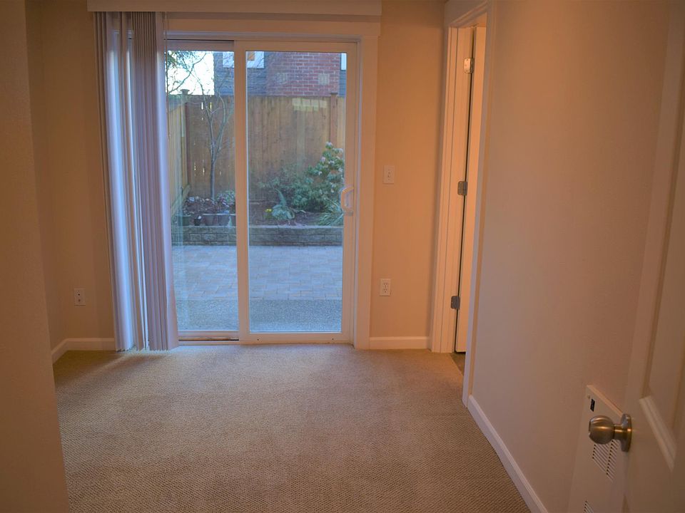 Ground level bedroom with attached 3/4 bath and access to fenced rear yard.