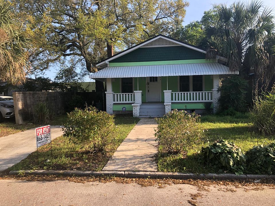 Front with driveway to left
