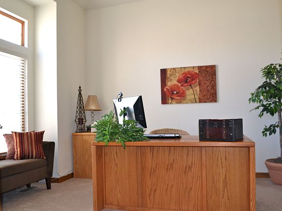 Main floor study/optional 5th bedroom with vaulted ceilings and walk-in closet