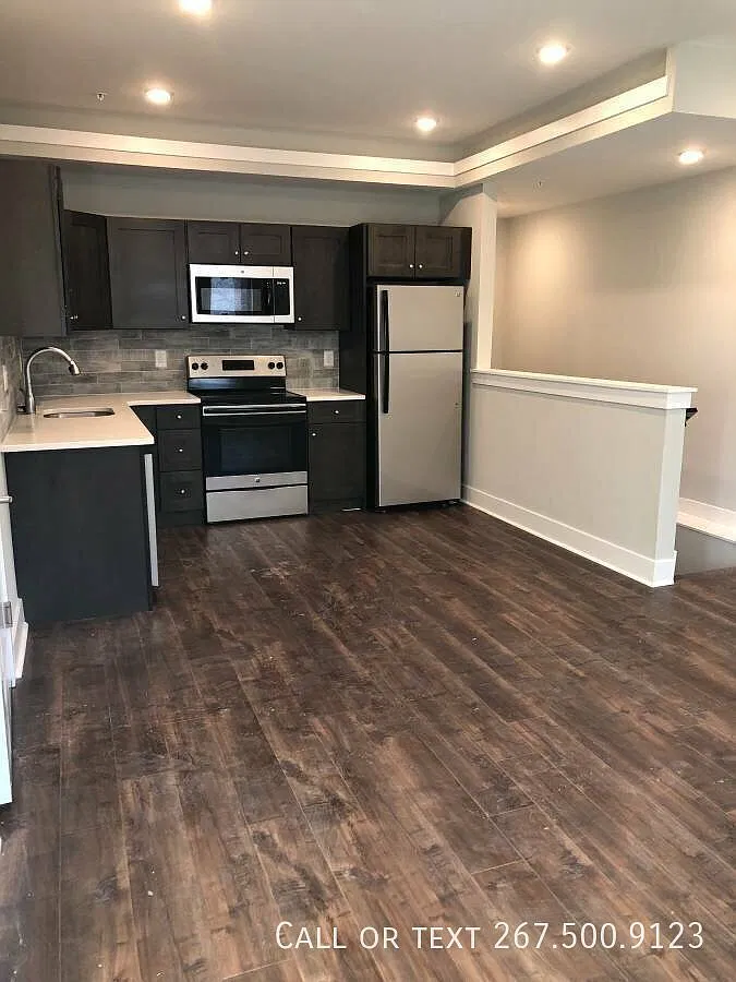 Bi-Level two bedroom with washer/dryer. Available this May! — Photo 3