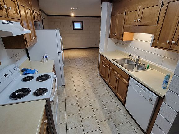 Kitchen with new electric range and refrigerator; plenty of cabinets & DW