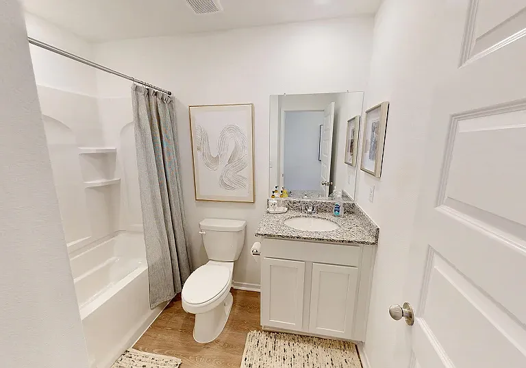 Bathroom 2
This full-size bathroom offers easy access to a single vanity and shower-tub combo near the front of the home.