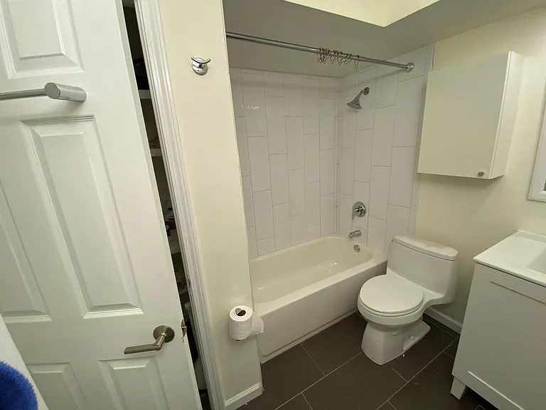 Showing the door to the linen closet in the bathroom.