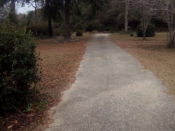 Driveway leading out to dirt