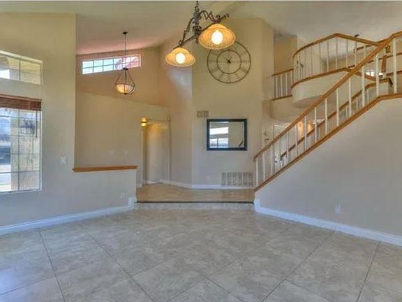 Formal living/sitting room with plenty of windows and light.