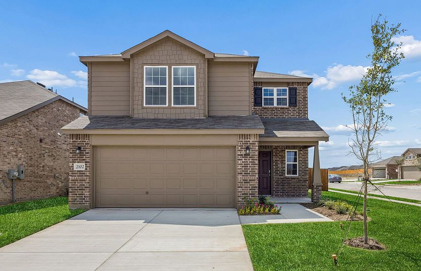 The Coolidge, a 2-story new construction home with a two car garage