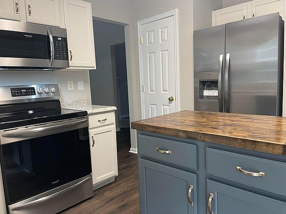 Stainless appliances. Pantry closet for storage.
