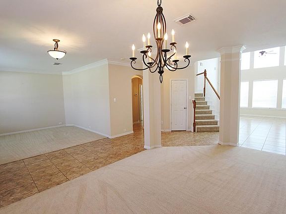 Looking from the  dining room to the living area (at the left of photo) and to the family room at the right.