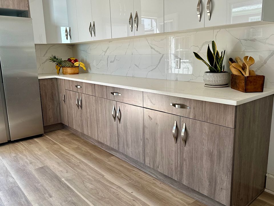 First Floor :Freshly renovated kitchen, new stainless steel Samsung appliances, side by side refrigerator, new stove, new floors.