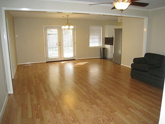 Living Room/ Dining Room combo 23 x 16.  French doors lead to covered back patio and spacious back yard with pecan trees!