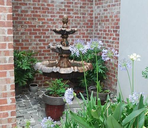 Fountain in cobblestone alcove