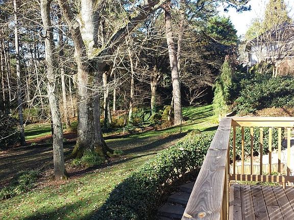 Two priceless, 300 year old red oak trees adorn the gorgeous 1-acre lot.