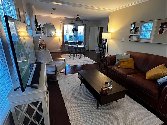 A dining room area used as a huge TV space.