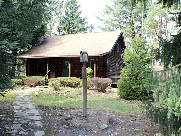 Walkup view of log house
