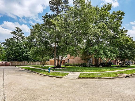 Magnificant mature trees surround this generous corner lot adding to the home's beauty.