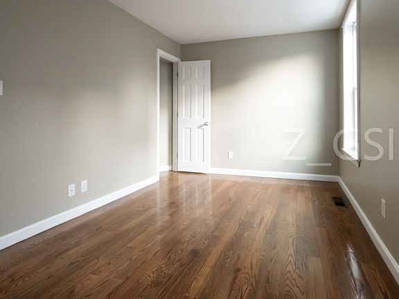 Living room showing door to closet
