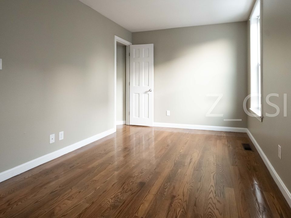 Living room showing door to closet