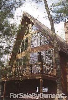 Beautiful Lakeside Cedar Home
						:
						Panoramic view of Arnold Lake through extensive Andersen windows treatment