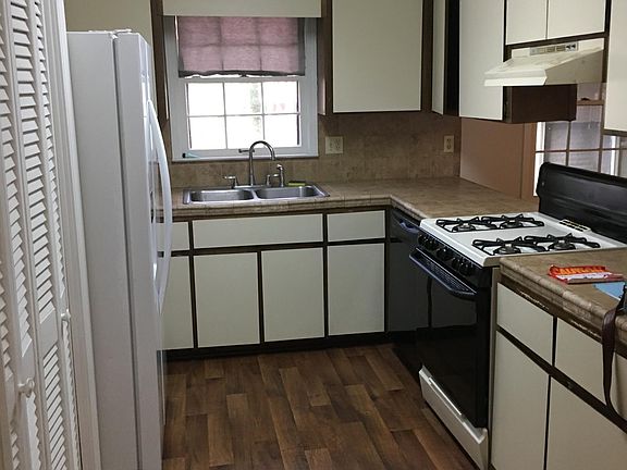 Kitchen with refrigerator and gas stove