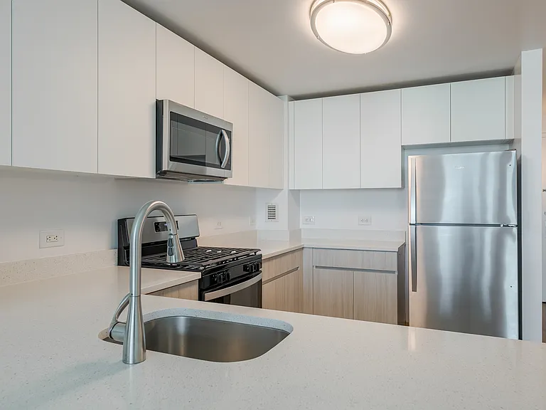 Sleek stainless steel appliances and modern cabinetry